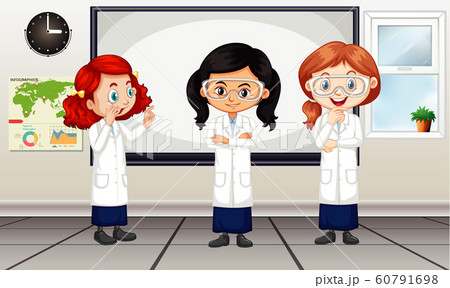 Classroom scene with three girls in lab gown 60791698
