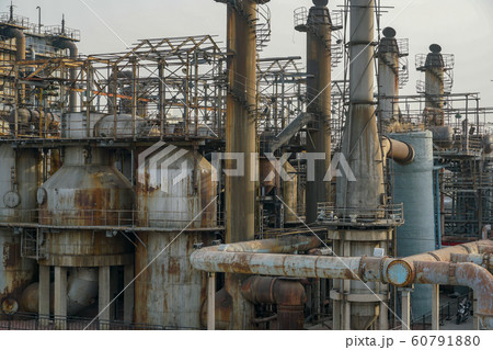 ndustrial plant with old rusty pipes and cooling tower 60791880