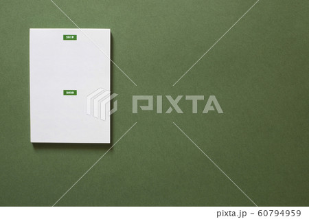 Notepad with inscription 2018 and 2019 on a green Notepad with inscription 2018 and 2019 on a green 60794959