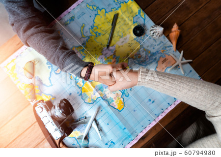 Woman with friend planning for vacation trip with Woman with friend planning for vacation trip with 60794980