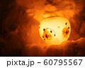 Candle light in ice and snow on Christmas day 60795567