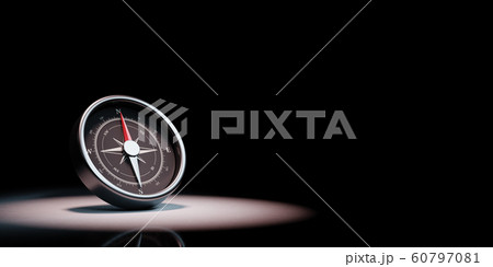 Compass Spotlighted on Black Background 60797081