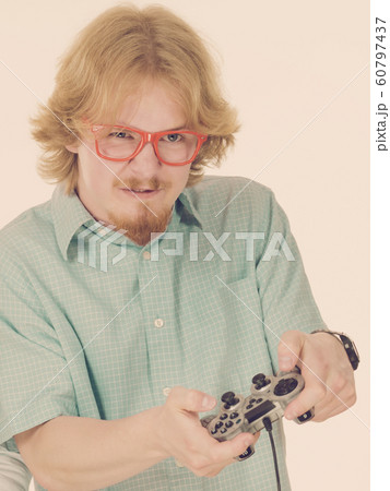 Gamer man holding gaming pad 60797437