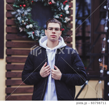 fashionable man stands on the street 60798711