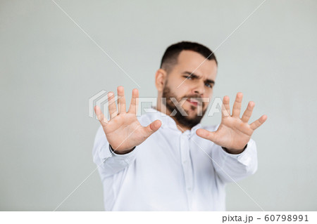 handsome bearded man showing stop gesture handsome bearded man showing stop gesture 60798991
