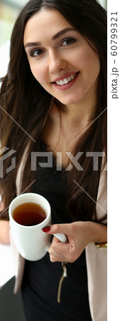 Beautiful smiling girl hold in arms cup portrait 60799321