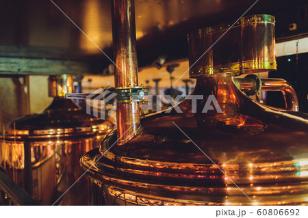 Craft beer brewing equipment in brewery Metal tanks, alcoholic drink production. Craft beer brewing equipment in brewery Metal tanks, alcoholic drink production. 60806692
