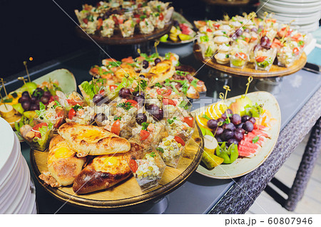 Assorted Chinese food set. Chinese noodles, fried rice, dumplings, peking duck, dim sum, spring rolls. Famous Chinese cuisine dishes on table. Top view. Chinese restaurant concept. Asian style banquet 60807946