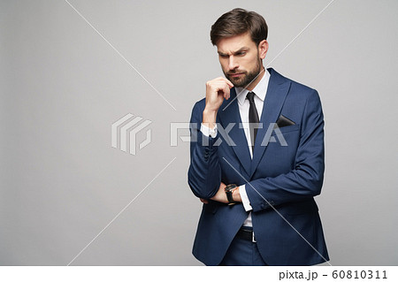 Studuo shot of thinking businessman wearing suit 60810311