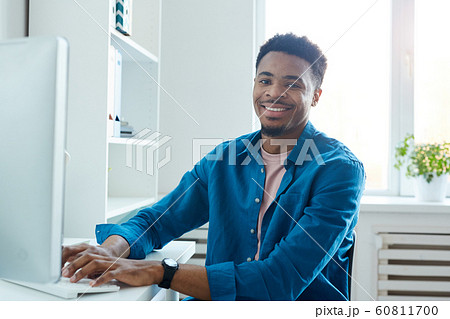 African designer working on computer African designer working on computer 60811700