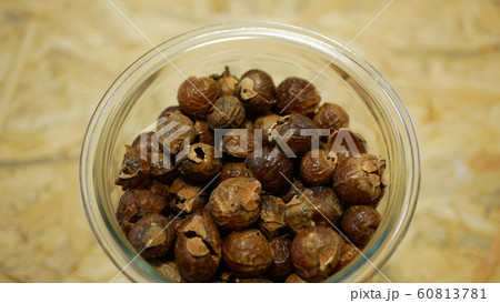 Soap nuts Indian soapberry or washnut glass jar cup, Sapindus mukorossi reetha or ritha from the soap tree shells are used to wash clothes to put drum washing machines. Nuts saponin plant fruit seeds Soap nuts Indian soapberry or washnut glass jar cup, Sapindus mukorossi reetha or ritha from the soap tree shells are used to wash clothes to put drum washing machines. Nuts saponin plant fruit seeds 60813781