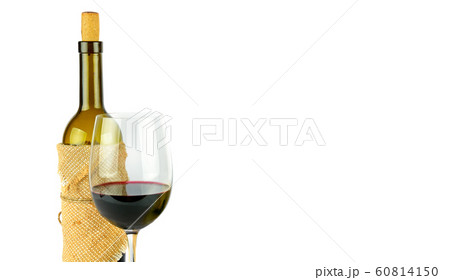 Bottle and glass of red wine isolated on a white 60814150