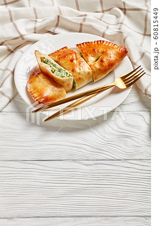 freshly baked Calzone, closed pizza, top view freshly baked Calzone, closed pizza, top view 60815449