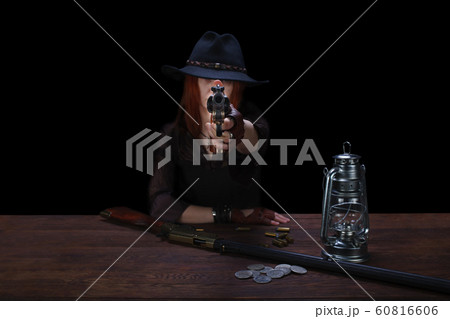 wild west girl shooting from revolver gun wild west girl shooting from revolver gun 60816606