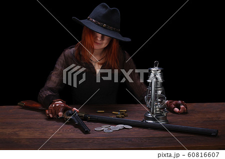 wild west girl shooting from revolver gun wild west girl shooting from revolver gun 60816607