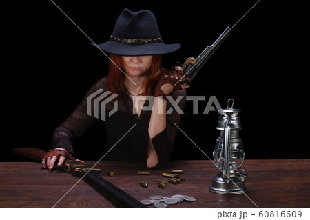 wild west girl shooting from revolver gun wild west girl shooting from revolver gun 60816609