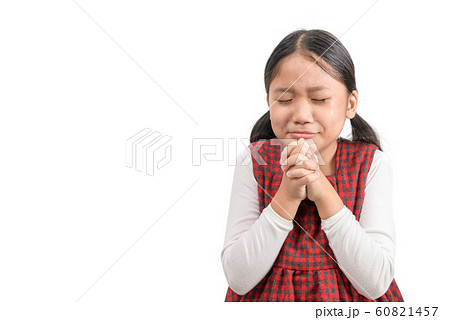 Cute girl praying and cry isolated on white 60821457