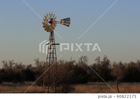 Windmill at Sunset with tree's and Sky. Windmill at Sunset with tree's and Sky. 60822175
