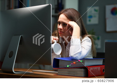 Lady holding cup 60827906