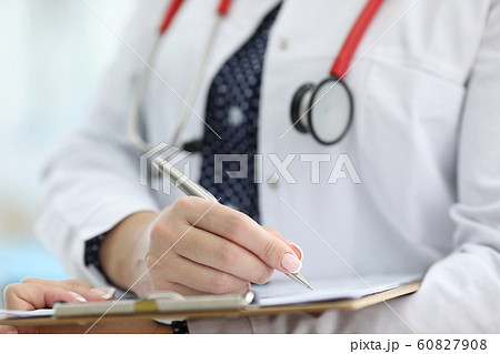 Woman holding silver pen 60827908