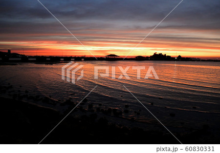 Dramatic twilight sky with silhouette of island 60830331
