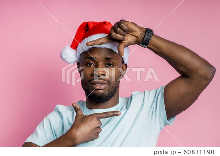 African american man wearing Santa hat 60831190