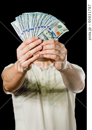 Close up of a businessman's hands holding money 60831787
