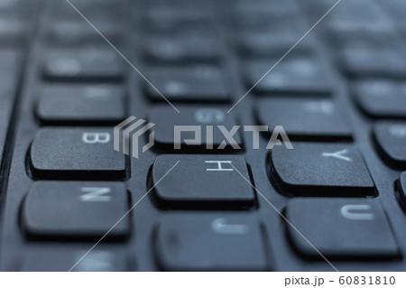 Modern black laptop keyboard closeup, english Modern black laptop keyboard closeup, english 60831810