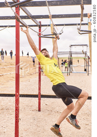 young person going through an obstacle course in a 60832580