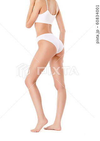 Slim woman's legs isolated on white background Slim woman's legs isolated on white background 60834001