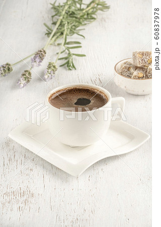 Cup of coffee served with Turkish delight on 60837978