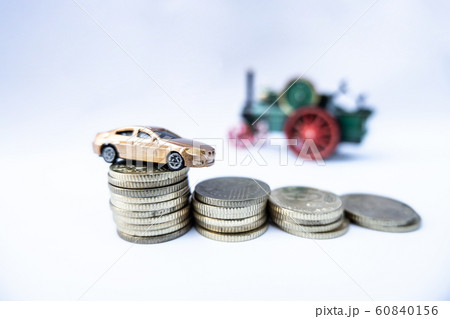 Toy cars with gold coins show To growth, saving money for car loans Toy cars with gold coins show To growth, saving money for car loans 60840156