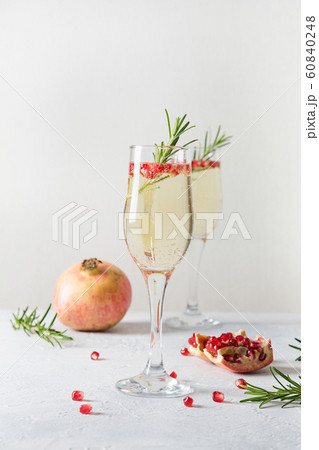 Pomegranate Christmas cocktail with rosemary 60840248