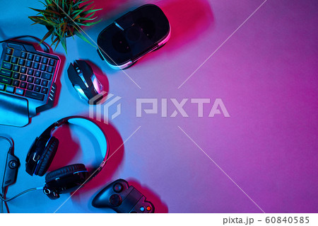 Keyboard, mouse, gamepad, virtual reality headset and headphones. 60840585