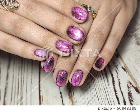 Gray striped nail design on female hand close up. Gray striped nail design on female hand close up. 60843389