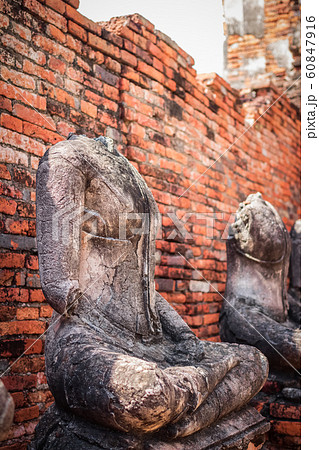 Old headless broken buddha statue at Ayutthaya 60847916