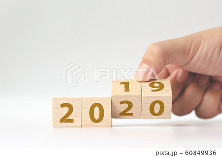 New year 2019 change to 2020 concept. Hand flip over wood cube block 60849936