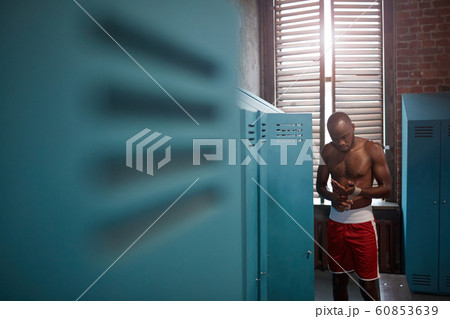 African boxer in locker room 60853639
