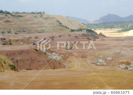 Earthworks at the construction site by construction heavy machinery to get the required platform level. Works carried out before building construction starts. 60861075