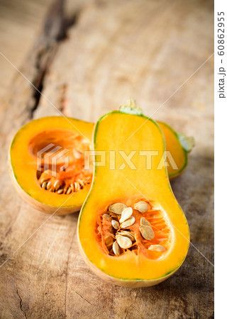 Fresh butternut squash on wooden background Fresh butternut squash on wooden background 60862955