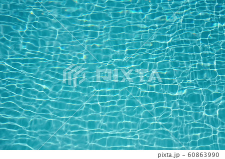 Closeup of clear pool water surface with ripples in trendy mint color. Closeup of clear pool water surface with ripples in trendy mint color. 60863990
