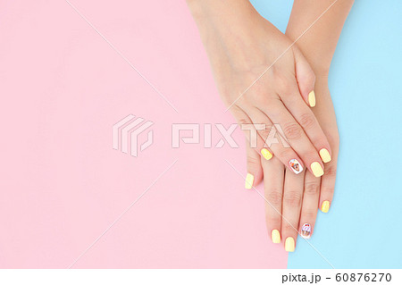 women's hands with a beautiful manicure with 60876270