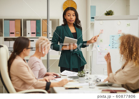 Stylish African American Businesswoman Making Report Stylish African American Businesswoman Making Report 60877806