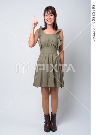 Portrait of beautiful Asian woman against white background 60885598