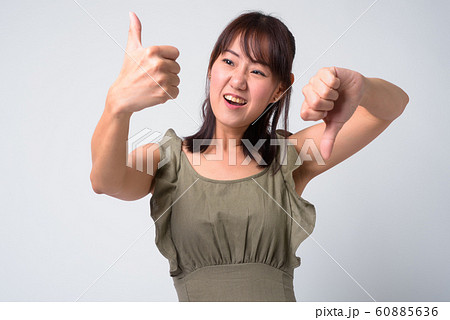 Portrait of beautiful Asian woman against white background 60885636