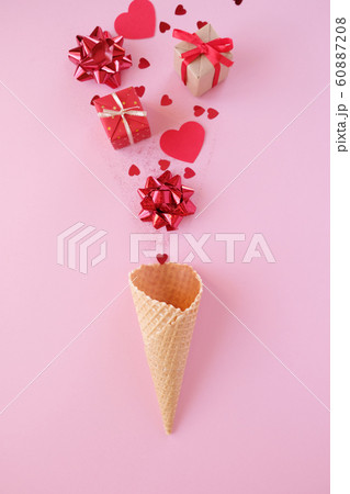 Waffle cone with valentine element on pink background. Holiday concept. Waffle cone with valentine element on pink background. Holiday concept. 60887208