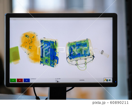 Scanned baggage on the x-ray scanner screen 60890211