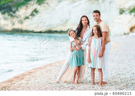 Happy family on the beach during summer vacation 60890215