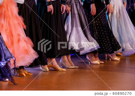 Girls in ball gowns at dance competition 60890270