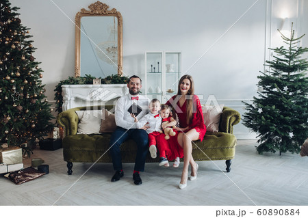 Happy festive family smiling posing at luxury 60890884